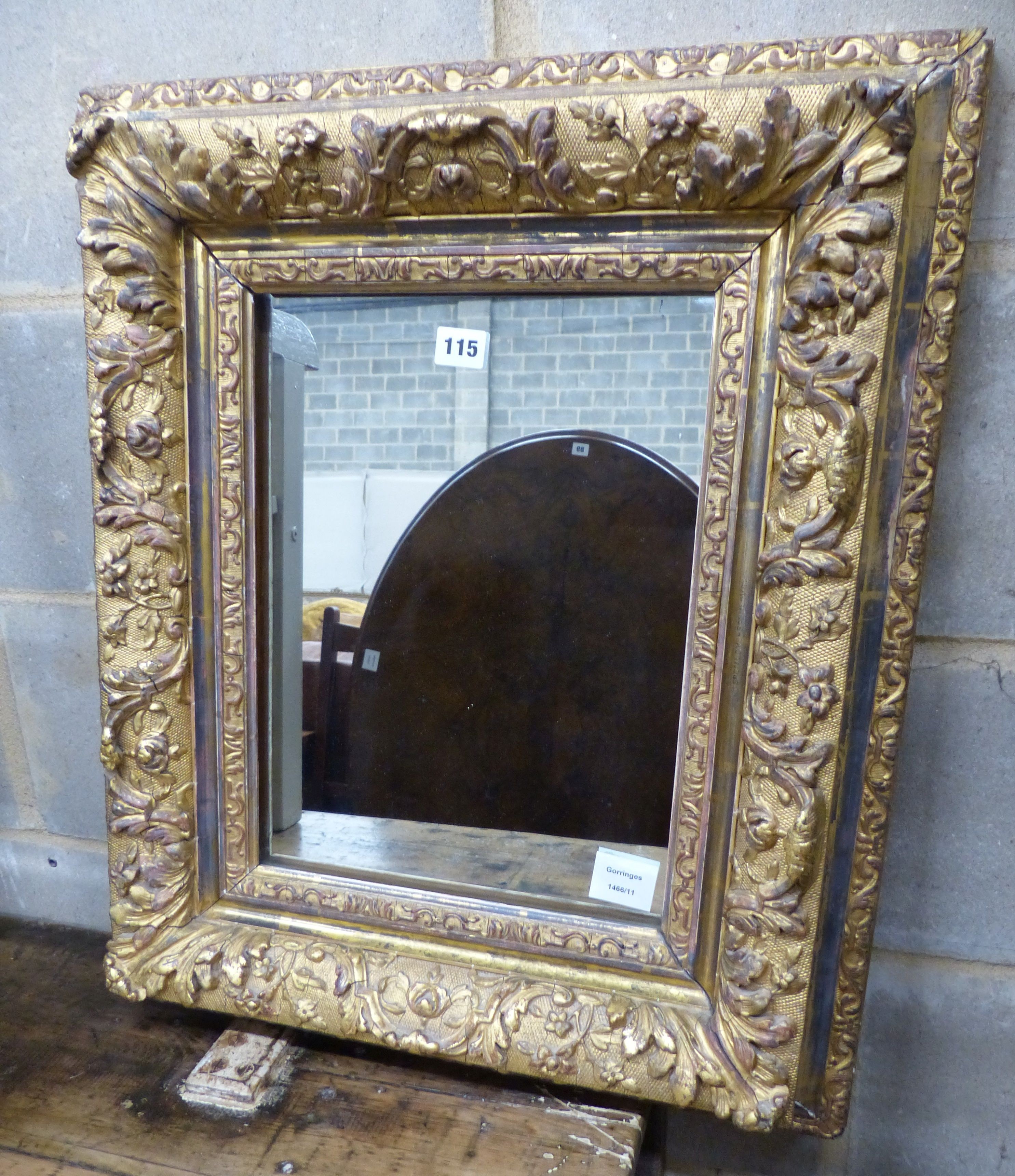A Victorian giltwood and gesso rectangular wall mirror, with acanthus and floral mounts, W.53cm H.66cm